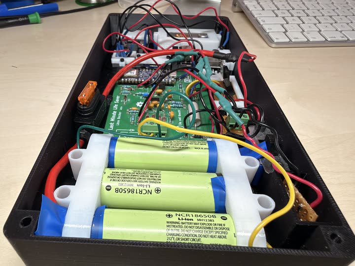 Three lithium-ion cells and the custom battery-management board