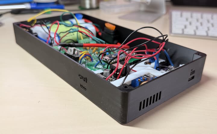 Side view of the open 3D-printed power bank enclosure